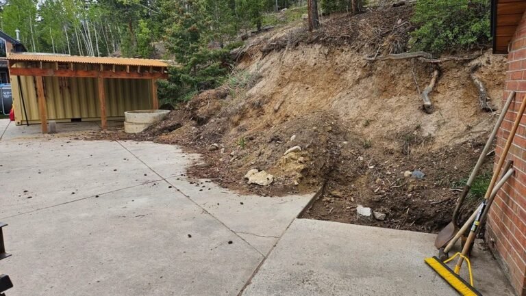 He Bolted Steel Posts to His Driveway and Built a Retaining Wall With 6×6 Timbers
