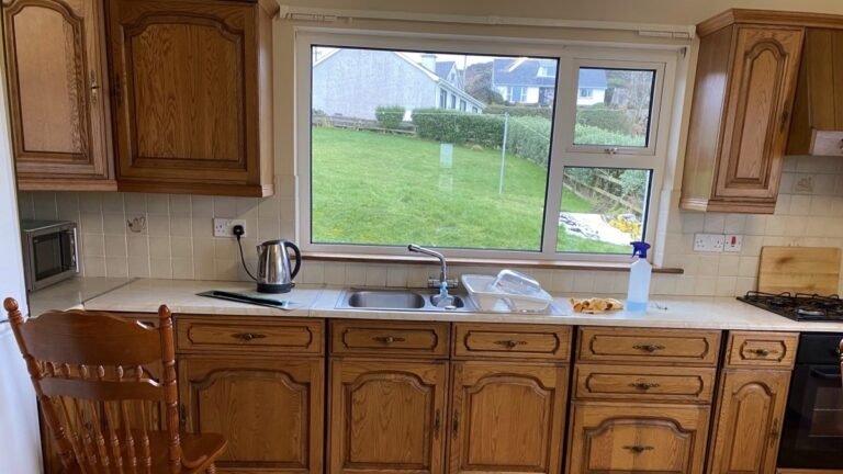 He Painted the Orange Oak Cabinets Deep Blue and the Kitchen Took on a Custom-Built Look