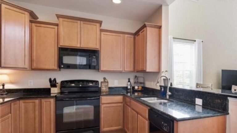 A Couple Painted the Oak Cabinets White and Crown Molding Finished the Custom-Built Look