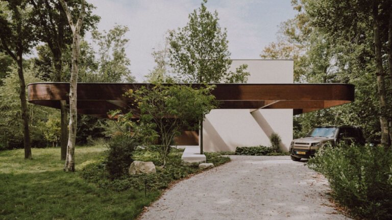 Dutch Forest Villa Frames Surrounding Trees in Grid Roofline