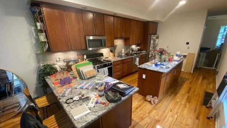 He Spray Painted the Orange Wood Cabinets Into a Two-Tone Design and the Kitchen Took on a Custom-Built Look