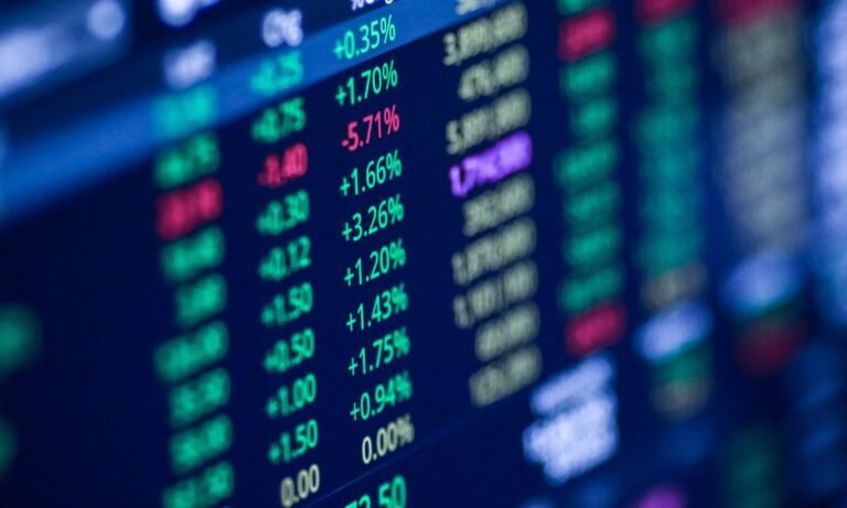 TSX hits record as Wall Street slips and oil swings on Iran deal doubts
